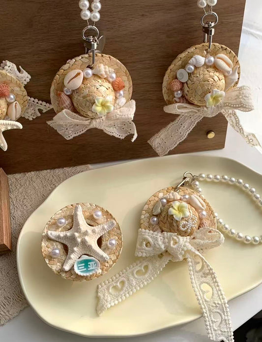 Shell and straw hat charm