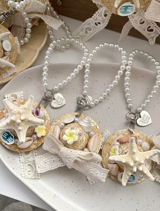Shell and straw hat charm