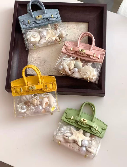 Shell-shaped handbag fridge magnet