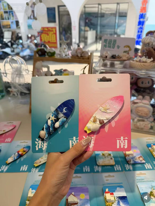 Shell-shaped surfboard fridge magnet